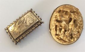 A carved bone and gold mounted brooch together wit