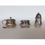 A small circular three piece cruet with reeded dec