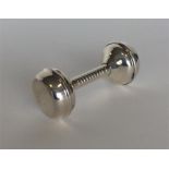 A modern Sterling rattle with reeded decoration. A