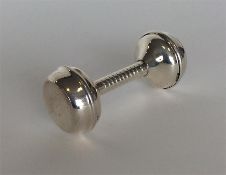 A modern Sterling rattle with reeded decoration. A