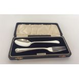 A cased two piece christening set with reeded desi