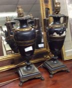 A pair of large heavy brass mounted lamps.