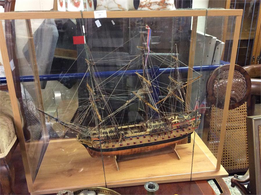 A figure of a Galleon contained within a glass cas