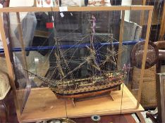 A figure of a Galleon contained within a glass cas