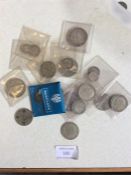 A collection of silver and other coins.