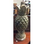 An unusual lamp in the form of a pineapple.