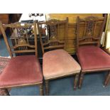 A set of three Edwardian rosewood dining chairs.