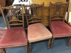 A set of three Edwardian rosewood dining chairs.