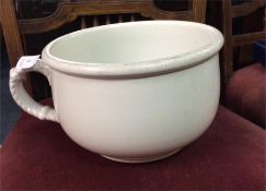 A White Star chamber pot. Marked to base.