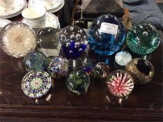 A large group of glass paperweights.