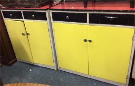 A pair of retro painted two door kitchen units tog