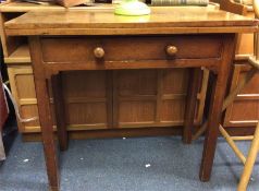 A mahogany single drawer hinged top table.