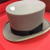 A grey and black top hat.