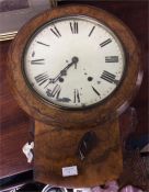 A walnut veneered old school clock.