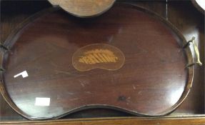 An Edwardian mahogany kidney shaped tray.