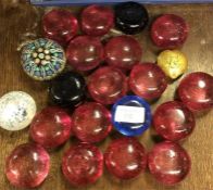 A large collection of glass paperweights.