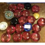 A large collection of glass paperweights.