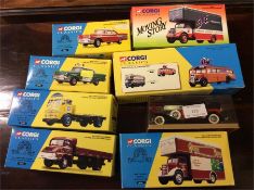 A group of seven boxed Corgi lorries and cars.
