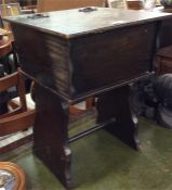 An old wooden sewing table.