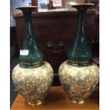 A good pair of Royal Doulton baluster shaped vases
