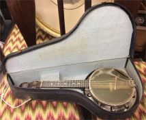 An old cased banjo.
