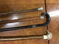 Two silver mounted walking canes etc.