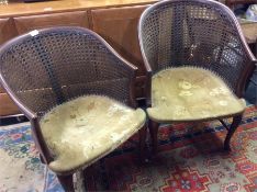 A pair of Bergere chairs together with a pair of b