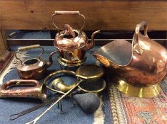 A copper coal scuttle, hunting horns etc.