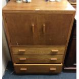 An oak three drawer tallboy.