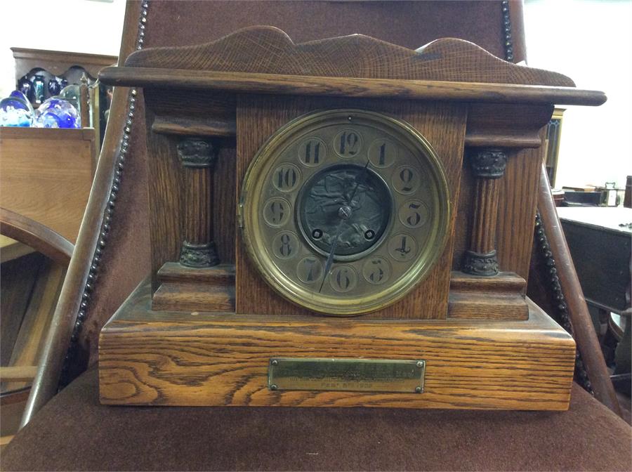 An oak mantle clock.