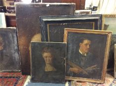 A collection or large unframed portraits.