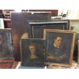 A collection or large unframed portraits.