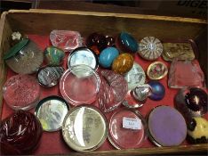 A collection of glass and other paperweights.