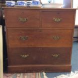 A chest of four drawers.