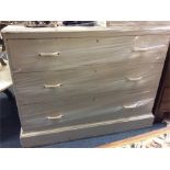 A pine chest of three drawers.