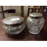 Two silver mounted dressing table jars.
