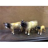 Three Beswick bulls.