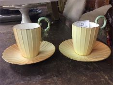 A pair of decorative Royal Worcester coffee cups.