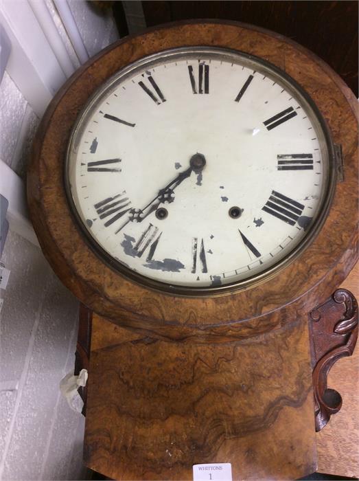 An Antique walnut wall clock.