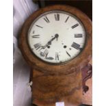 An Antique walnut wall clock.