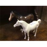 Two Beswick horses.