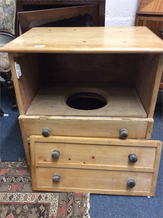 A pine commode.