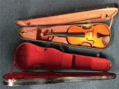 An old violin together with one other.