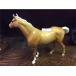 A Beswick horse.