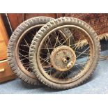 Two old wheels from a clown's circus cart.