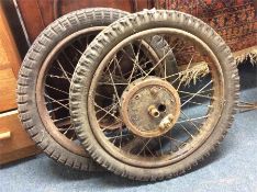 Two old wheels from a clown's circus cart.