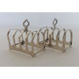 A pair of four bar silver toast racks. Sheffield. By EV.