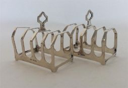 A pair of four bar silver toast racks. Sheffield. By EV.