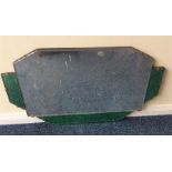 A good Art Deco green glass mirror on oak panelled