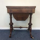 A burr walnut sewing box with fitted interior on t